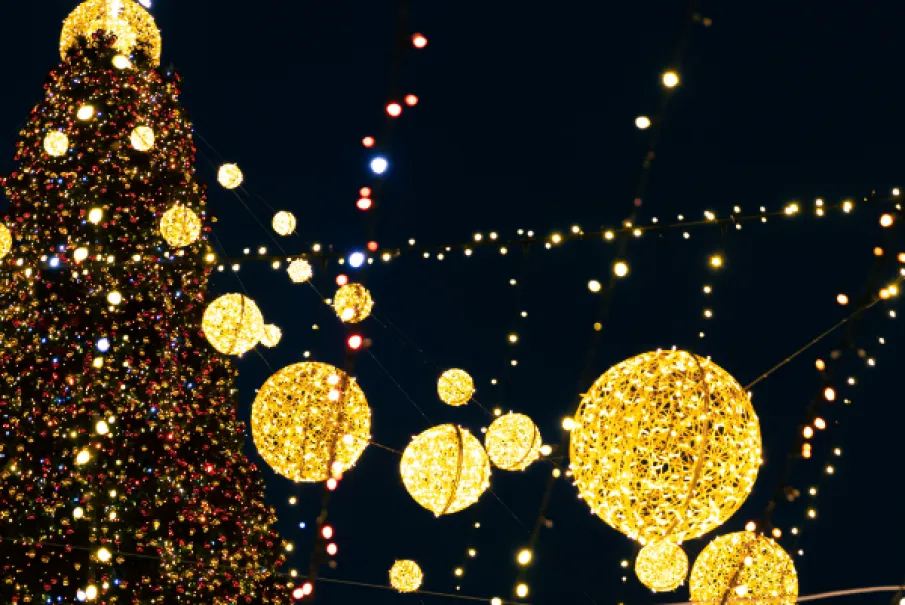 Christmas tree with twinkling lights at night