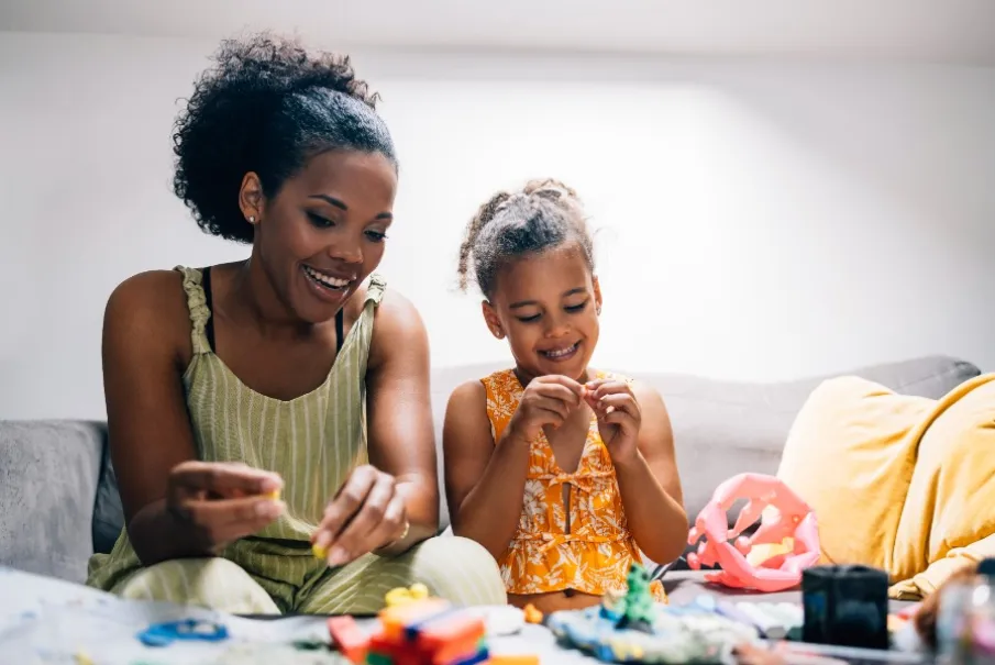 Mother and daughter crafting together at home