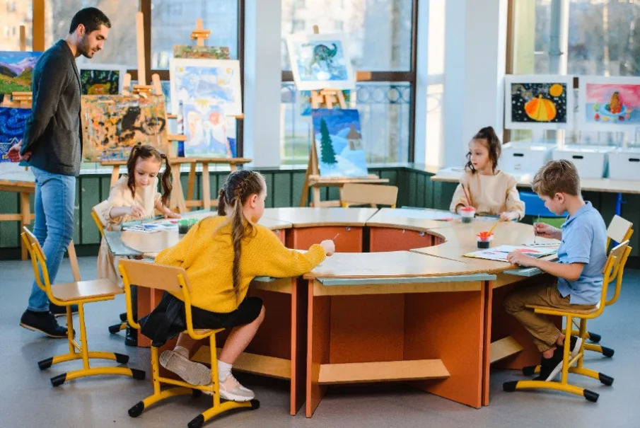 Children painting in an art classroom