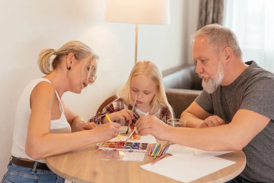 Family painting activity at home with parents and child