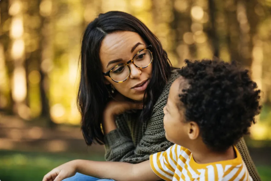 Mother and child having a conversation in a park